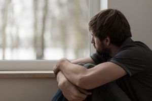 Young man looking out the window