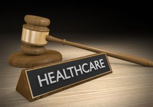 Healthcare Sign next to gavel